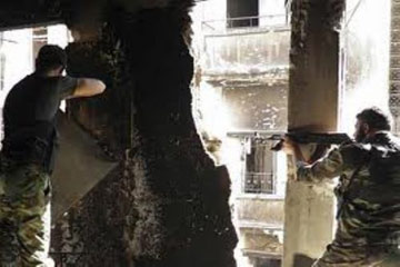 اشتباكات عنيفة بمحيط مطار دمشق والأسد يقصف بلدة “بيت نايم”