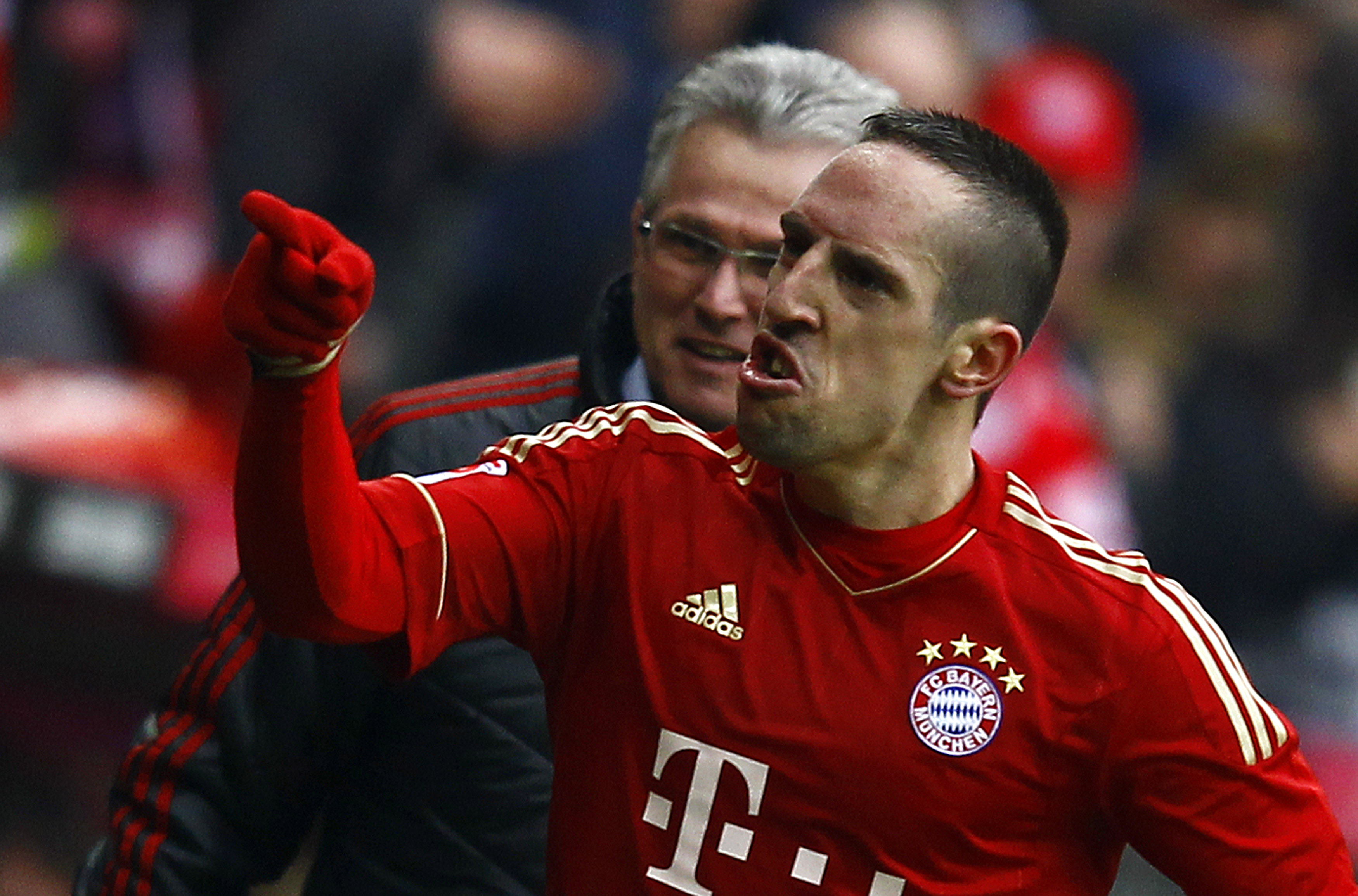 Franck Ribery of Bayern Munich celebrates a goal against FC Schalke 04 with coach Jupp Heynckes during their German first division Bundesliga soccer match in Munich
